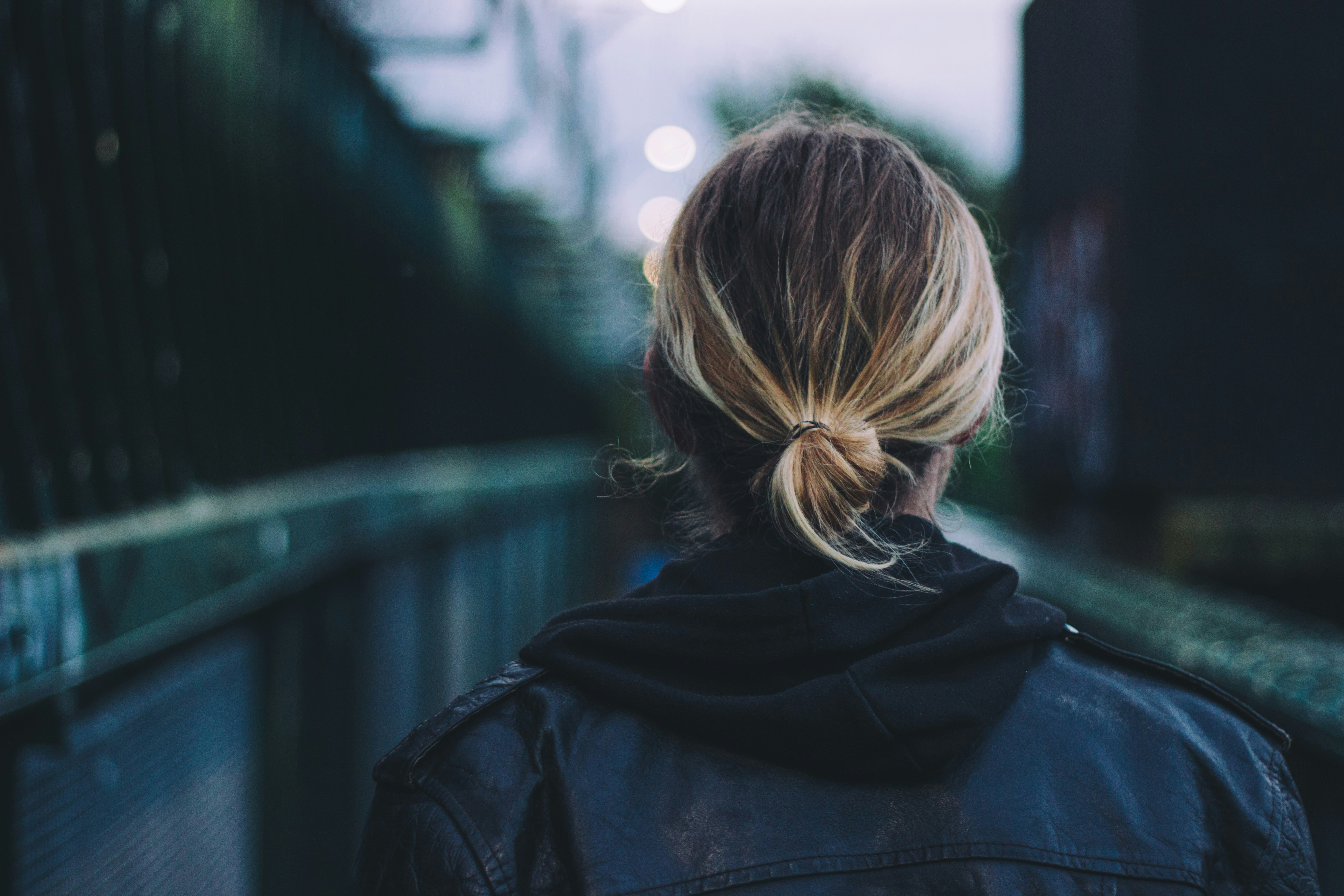 woman wearing black jacket walking